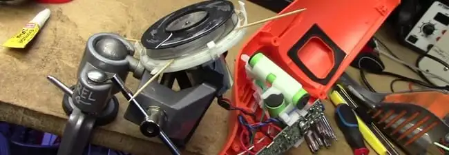 Vacuum cleaner repair parts and tools on a workbench in Honolulu, HI