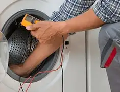 Washing machine repair technician testing a front-load washer with diagnostic tools in Honolulu, HI